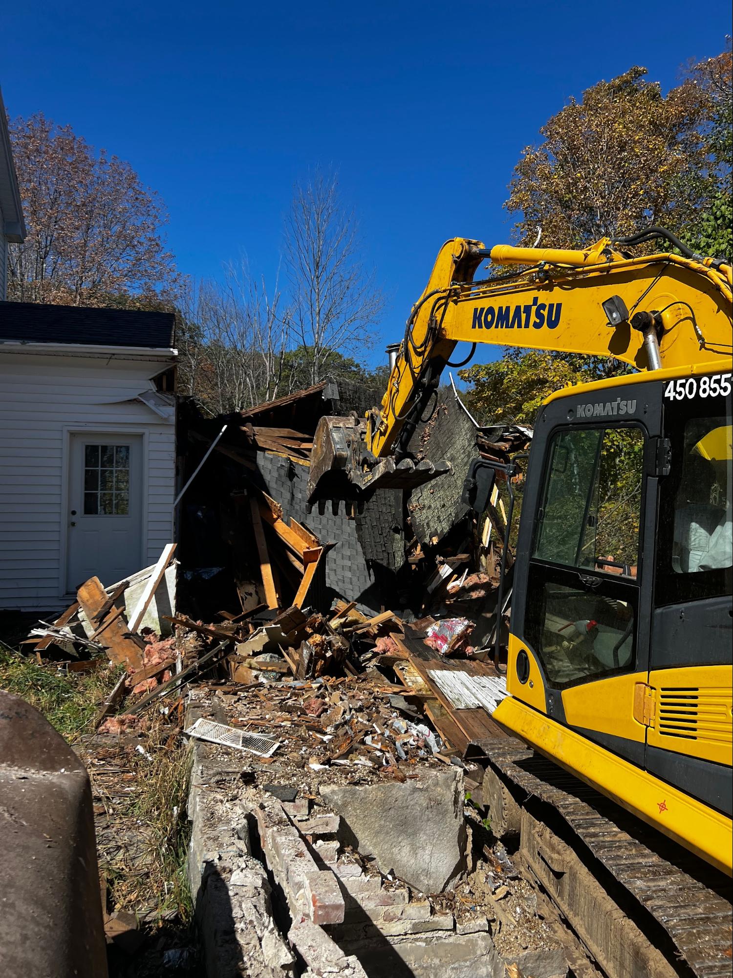 Komatsu excavator tearing down structure
